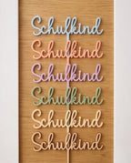 Cake Topper "Schulkind" aus Acryl | Eleganter Tortenstecker für die Einschulung in Wunschfarbe